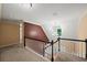 Hallway features natural light and views of the stairs at 1212 Lee Whatley Dr, Lithonia, GA 30058