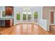 Kitchen breakfast area with hardwood floors, light blue walls, and backyard views at 1212 Lee Whatley Dr, Lithonia, GA 30058