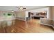 Open-concept living and kitchen area showcasing hardwood floors and neutral color palette at 1212 Lee Whatley Dr, Lithonia, GA 30058