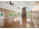 Expansive living room featuring a stone fireplace, cathedral ceilings and ample natural light at 1212 Lee Whatley Dr, Lithonia, GA 30058
