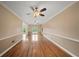 Spacious living room features hardwood floors, neutral walls and ample natural light at 1212 Lee Whatley Dr, Lithonia, GA 30058