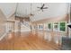 Bright living room with hardwood floors, tall ceilings, staircase, and large windows offering natural light at 1212 Lee Whatley Dr, Lithonia, GA 30058