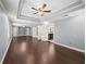 Large main bedroom boasts hardwood floors, tray ceiling, and adjoining bath at 1212 Lee Whatley Dr, Lithonia, GA 30058