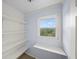 Walk-in pantry with shelving and a view from the window at 1212 Lee Whatley Dr, Lithonia, GA 30058
