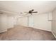 Spacious room with neutral carpeting and a ceiling fan for added comfort at 1212 Lee Whatley Dr, Lithonia, GA 30058