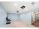 An empty room with light blue walls, ready for customization with an office chair on one side at 1212 Lee Whatley Dr, Lithonia, GA 30058