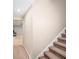 Staircase leads to a finished basement with extra living space at 1212 Lee Whatley Dr, Lithonia, GA 30058