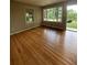 Bright living room with hardwood floors, large windows, and neutral paint at 2069 Bixler Circle, Decatur, GA 30032