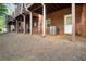 Backyard features brick exterior, an open yard, and a view of decks above at 2108 Waters Edge Trl, Roswell, GA 30075