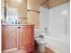 Bathroom with a wood vanity, granite countertop, and a shower/tub combo at 2108 Waters Edge Trl, Roswell, GA 30075
