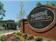 Entrance to 'The Heritage at Roswell' community, near a guard house and landscaping at 2108 Waters Edge Trl, Roswell, GA 30075