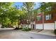 View of the townhouse complex featuring well-manicured greenery and inviting facades at 2108 Waters Edge Trl, Roswell, GA 30075