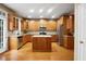Spacious kitchen with an island, stainless steel appliances, and ample cabinet storage at 2108 Waters Edge Trl, Roswell, GA 30075