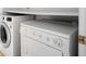 Laundry Room featuring newer model washing machine and dryer at 2108 Waters Edge Trl, Roswell, GA 30075