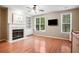 Bright and airy living room featuring a fireplace, built-ins, and large windows at 2108 Waters Edge Trl, Roswell, GA 30075