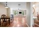 Open-concept living and dining space with fireplace, powder room, and hardwood floors at 2108 Waters Edge Trl, Roswell, GA 30075