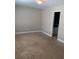 Bedroom leads to bathroom featuring neutral walls and carpeting throughout at 31 Villa Se Ct, Smyrna, GA 30080
