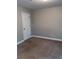 Neutral bedroom with a white door and neutral carpeting at 31 Villa Se Ct, Smyrna, GA 30080