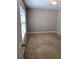 Bedroom with neutral walls, and carpet, door leading out at 31 Villa Se Ct, Smyrna, GA 30080