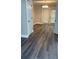 Dining area with modern flooring and a chandelier, adjacent to a set of glass doors at 31 Villa Se Ct, Smyrna, GA 30080