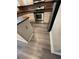 Kitchen with stainless steel appliances, stone countertops, and wood floors at 31 Villa Se Ct, Smyrna, GA 30080