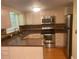 Kitchen with stainless steel appliances and stone countertops at 31 Villa Se Ct, Smyrna, GA 30080
