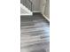 Living area featuring modern flooring and staircase with wrought iron railing at 31 Villa Se Ct, Smyrna, GA 30080