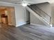 Open-concept living space with staircase, dining area, and modern flooring at 31 Villa Se Ct, Smyrna, GA 30080