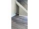 Living room with modern flooring and a staircase with decorative wrought iron railing at 31 Villa Se Ct, Smyrna, GA 30080