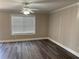 Bright living area with modern floors, crown molding, and large window at 31 Villa Se Ct, Smyrna, GA 30080