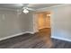 Open-concept living area with updated flooring, crown molding, and ceiling fan at 31 Villa Se Ct, Smyrna, GA 30080