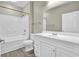 Bright bathroom with white vanity, bathtub and laminate floors at 3302 Dogwood Dr # 123, Atlanta, GA 30354