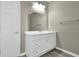 Bathroom featuring a white vanity with storage and a large mirror at 3302 Dogwood Dr # 123, Atlanta, GA 30354