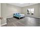 Bright and airy bedroom featuring a large window and hardwood floors at 3302 Dogwood Dr # 123, Atlanta, GA 30354