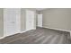 Spacious bedroom with laminate floors, neutral walls, and bright white trim at 3302 Dogwood Dr # 123, Atlanta, GA 30354