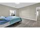 Well-lit bedroom featuring laminate flooring and a window at 3302 Dogwood Dr # 123, Atlanta, GA 30354