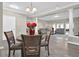 Open concept dining room, with views of the living room. Complete with gray vinyl floors and recessed lighting at 3302 Dogwood Dr # 123, Atlanta, GA 30354