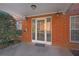 Brick entrance to the building with mailbox, small garden and glass doors at 3302 Dogwood Dr # 123, Atlanta, GA 30354