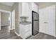 Kitchenette featuring gray cabinets, granite countertops and stainless-steel refrigerator at 3302 Dogwood Dr # 123, Atlanta, GA 30354