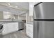 Open-concept kitchen with stainless steel appliances, granite countertops, and island seating at 3302 Dogwood Dr # 123, Atlanta, GA 30354
