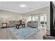 Bright living area with contemporary furnishings, hardwood floors and French doors to the backyard at 3302 Dogwood Dr # 123, Atlanta, GA 30354