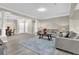 Open floor plan with hardwood floors, decorative columns, living, dining, and kitchen areas at 3302 Dogwood Dr # 123, Atlanta, GA 30354