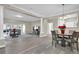 Open-concept living and dining area with hardwood floors, neutral paint, and plenty of natural light at 3302 Dogwood Dr # 123, Atlanta, GA 30354