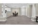 Open floor plan displaying modern interior, neutral walls, kitchen, and decorative columns at 3302 Dogwood Dr # 123, Atlanta, GA 30354
