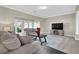 Cozy living room with fireplace, hardwood floors, and French doors to the backyard at 3302 Dogwood Dr # 123, Atlanta, GA 30354