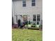Backyard with patio, barbecue grill, and greenery in the raised garden bed at 7848 Rock Rose Ln, Fairburn, GA 30213