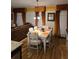 Cozy dining area with table seating for six and a view to the living room at 7848 Rock Rose Ln, Fairburn, GA 30213