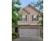 Charming two-story home featuring a brick-accented facade and a two-car garage at 7848 Rock Rose Ln, Fairburn, GA 30213