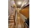 Bright hallway featuring wood floors, a staircase and eye catching decor at 7848 Rock Rose Ln, Fairburn, GA 30213