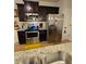 Kitchen featuring stainless steel appliances and granite countertops at 7848 Rock Rose Ln, Fairburn, GA 30213